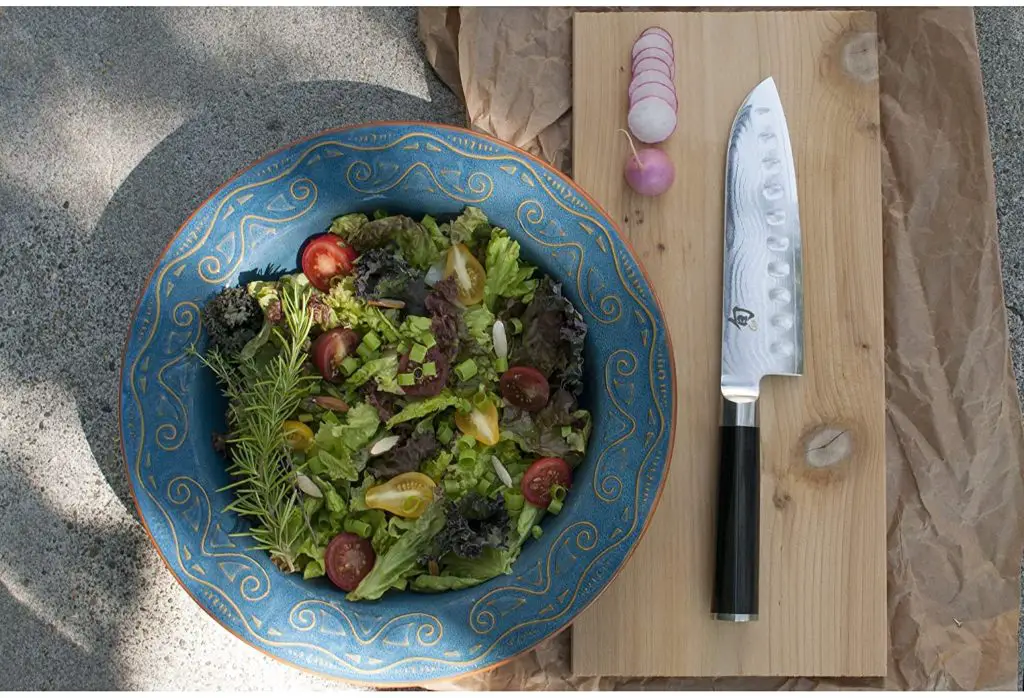 Shun classic 7 inch knife cutting vegetables
